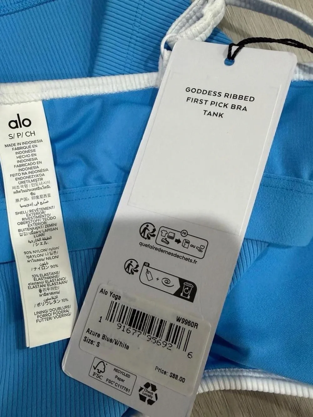 ALO Yoga Goddess Ribbed First Pick Bra Tank in Azure Blue with White Trim.